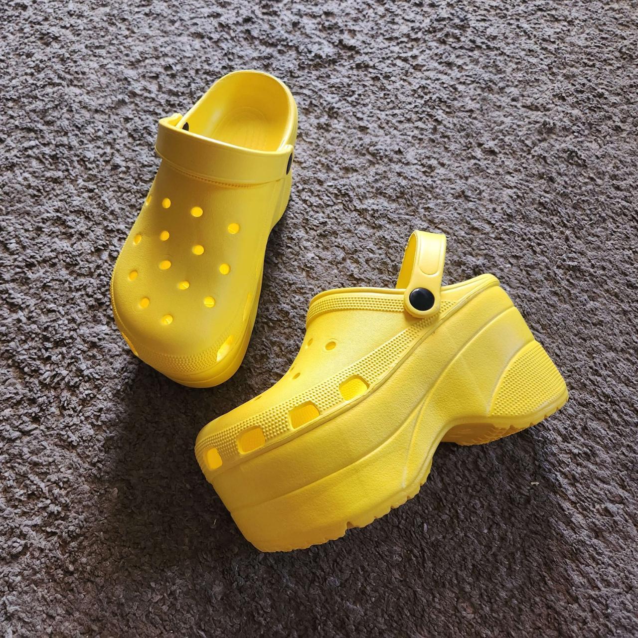 These are bright yellow, platform Crocs in a US... - Depop