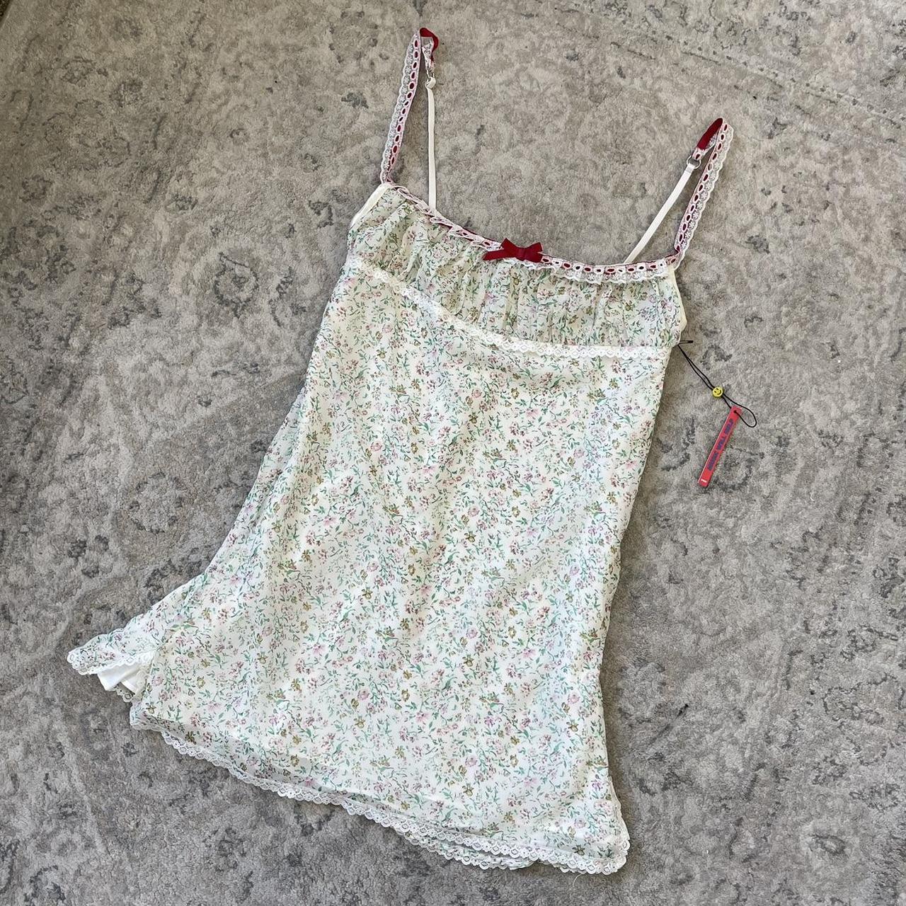 Unif XO Floral mini dress with lace trim detailing... Depop