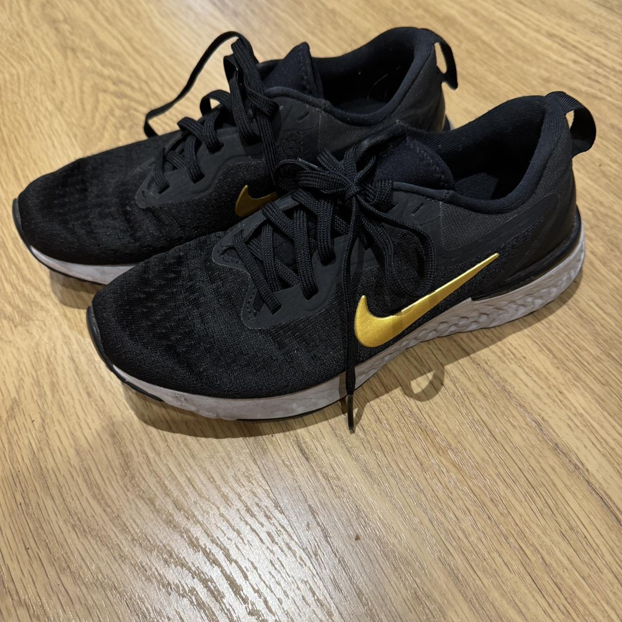 Nike black and gold trainers Odyssea react nike