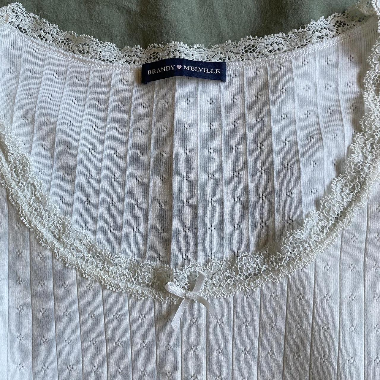 Bnwt brandy Melville Mckenna Ribbed eyelet crop top, Women's Fashion, Tops,  Longsleeves on Carousell