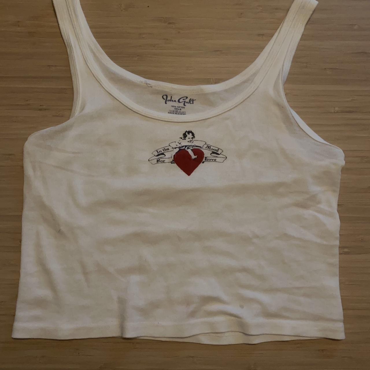 Brandy Melville heart tank top. Pretty see through.... Depop