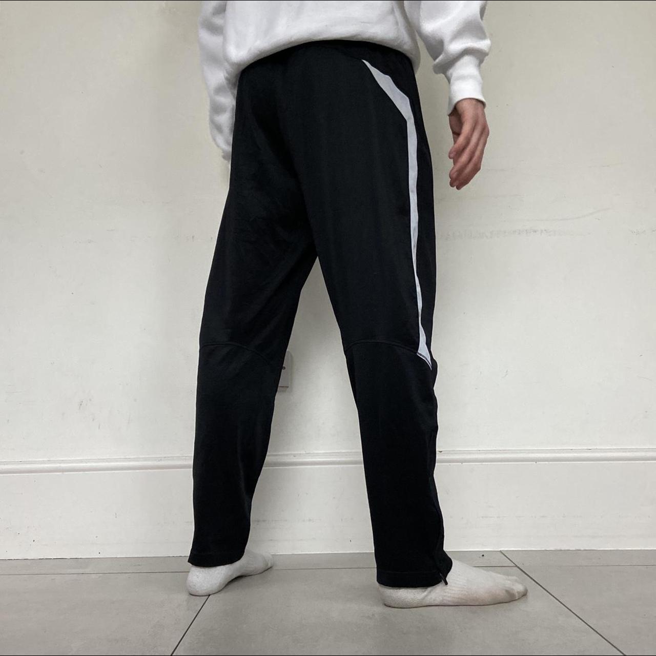 Black Nike Joggers with adjustable drawstring waist... - Depop