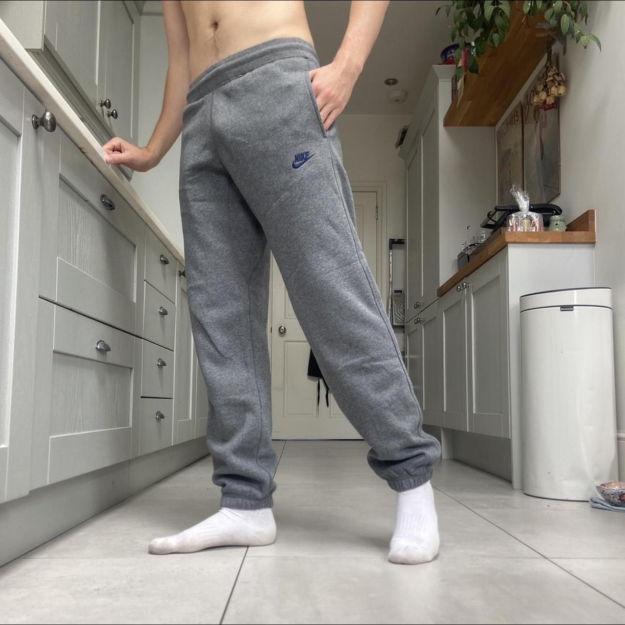 Grey Nike Joggers with adjustable drawstring waist... Depop