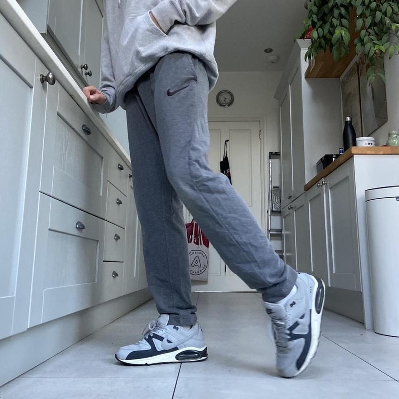 Grey Nike Joggers with adjustable drawstring waist... Depop