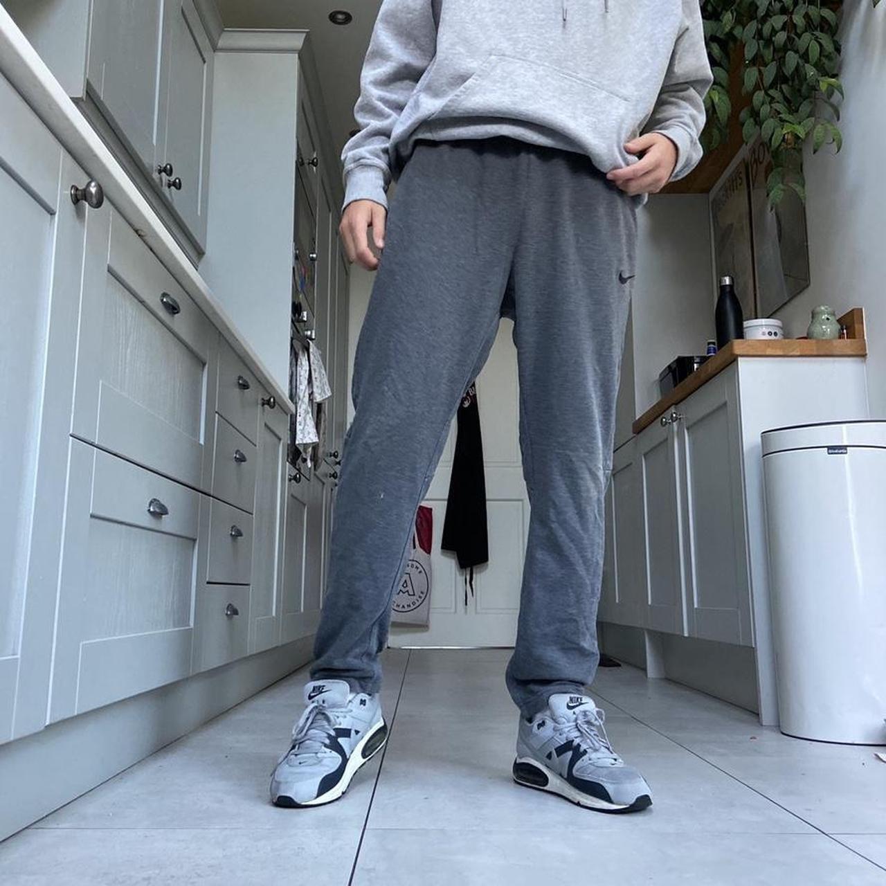 Grey Nike Joggers with adjustable drawstring waist... Depop