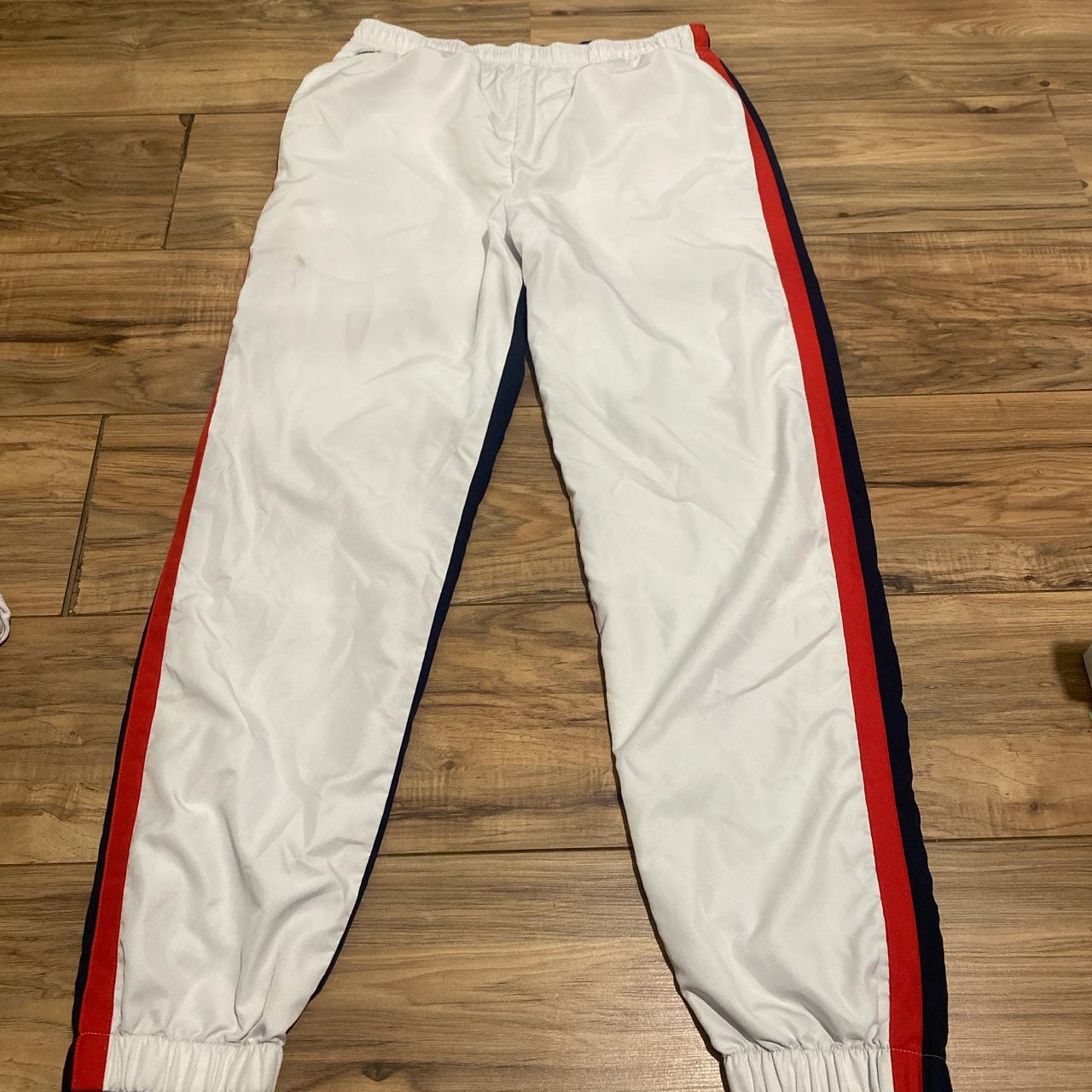 Lacoste joggers size large blue white and red - Depop