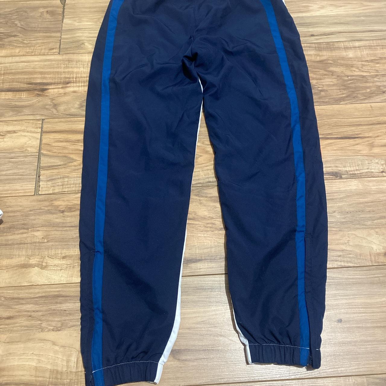 Lacoste joggers size large blue white and red - Depop