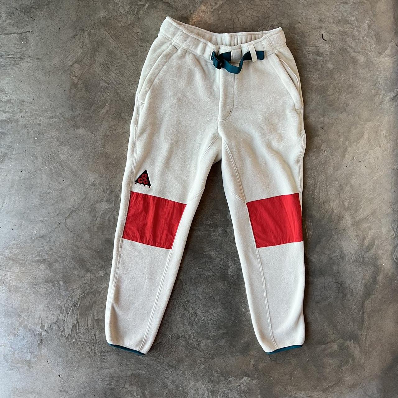 Nike acg fleece trousers with orange knee patches. Depop