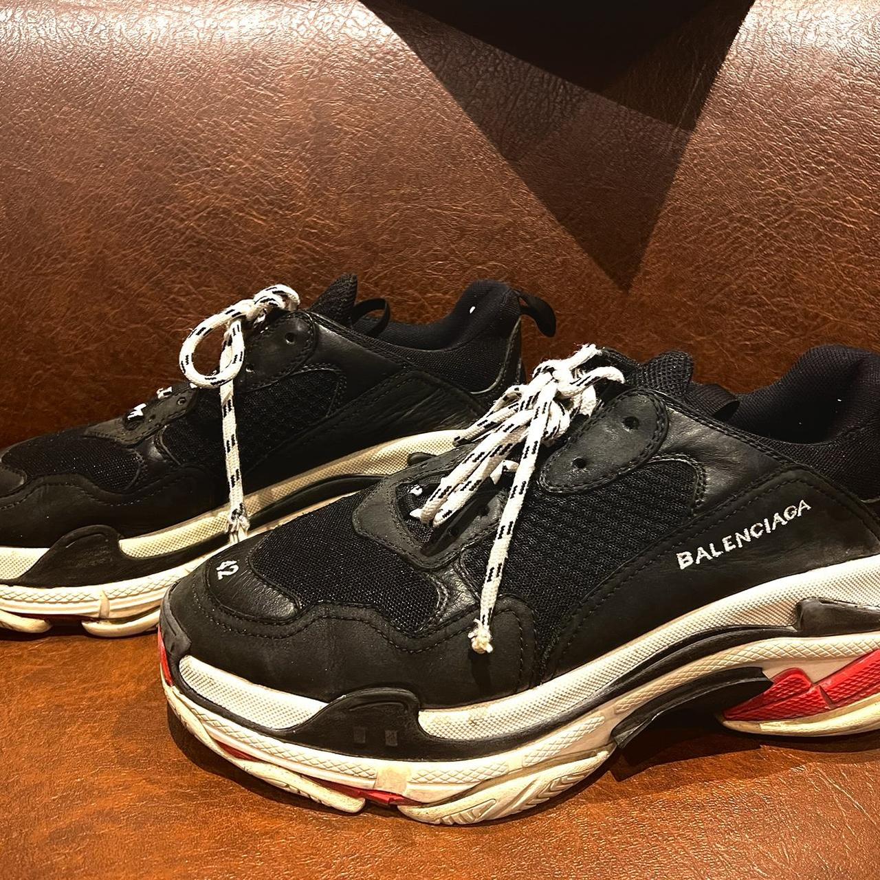 The second hand Balenciaga trainers show signs of