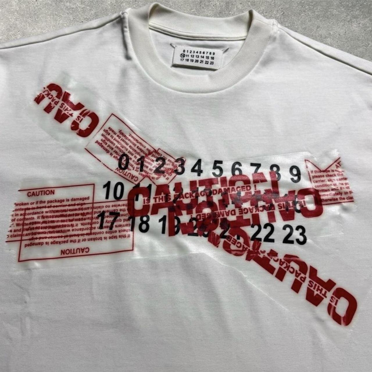 Maison margiela discount caution t shirt