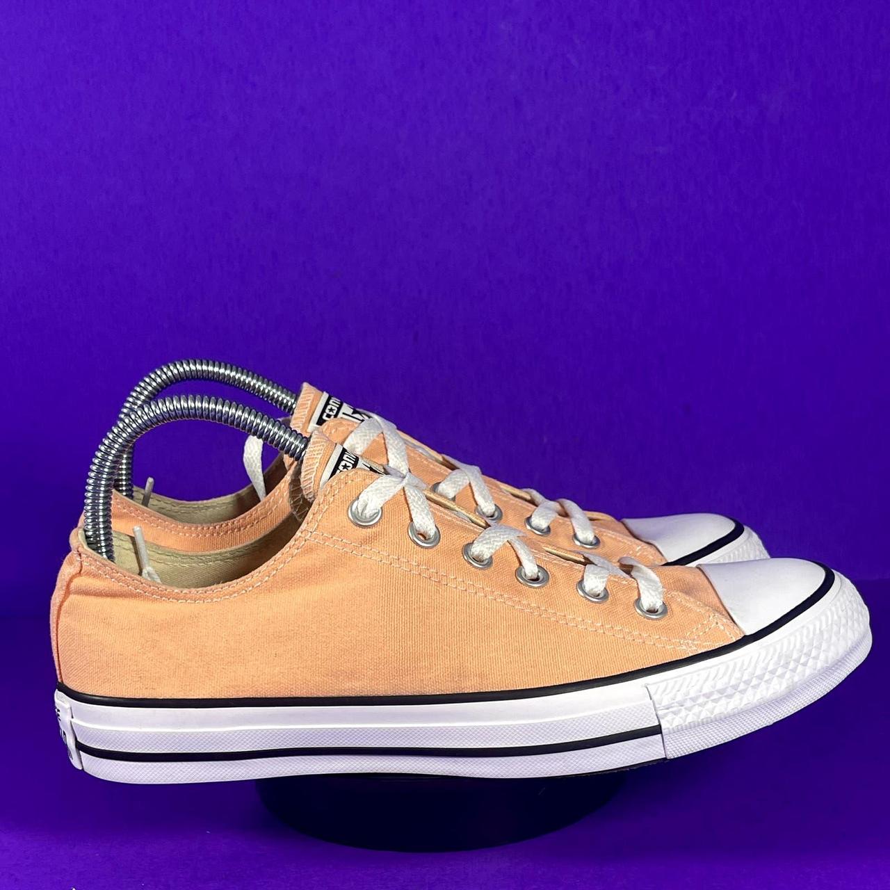 Orange chucks low top on sale