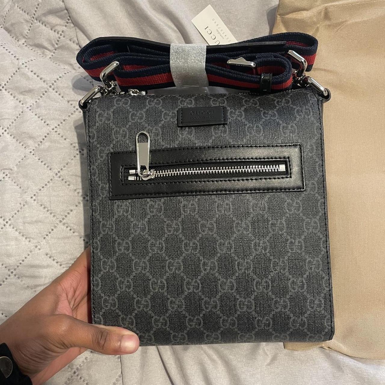 Gucci logo bag in black. Missing a tag on a zipper. - Depop