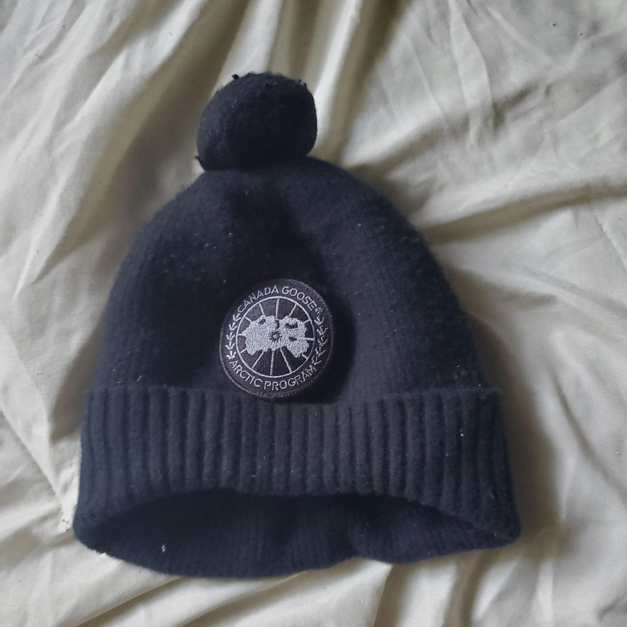 Black pompom Canada goose winter hat. wool beanie