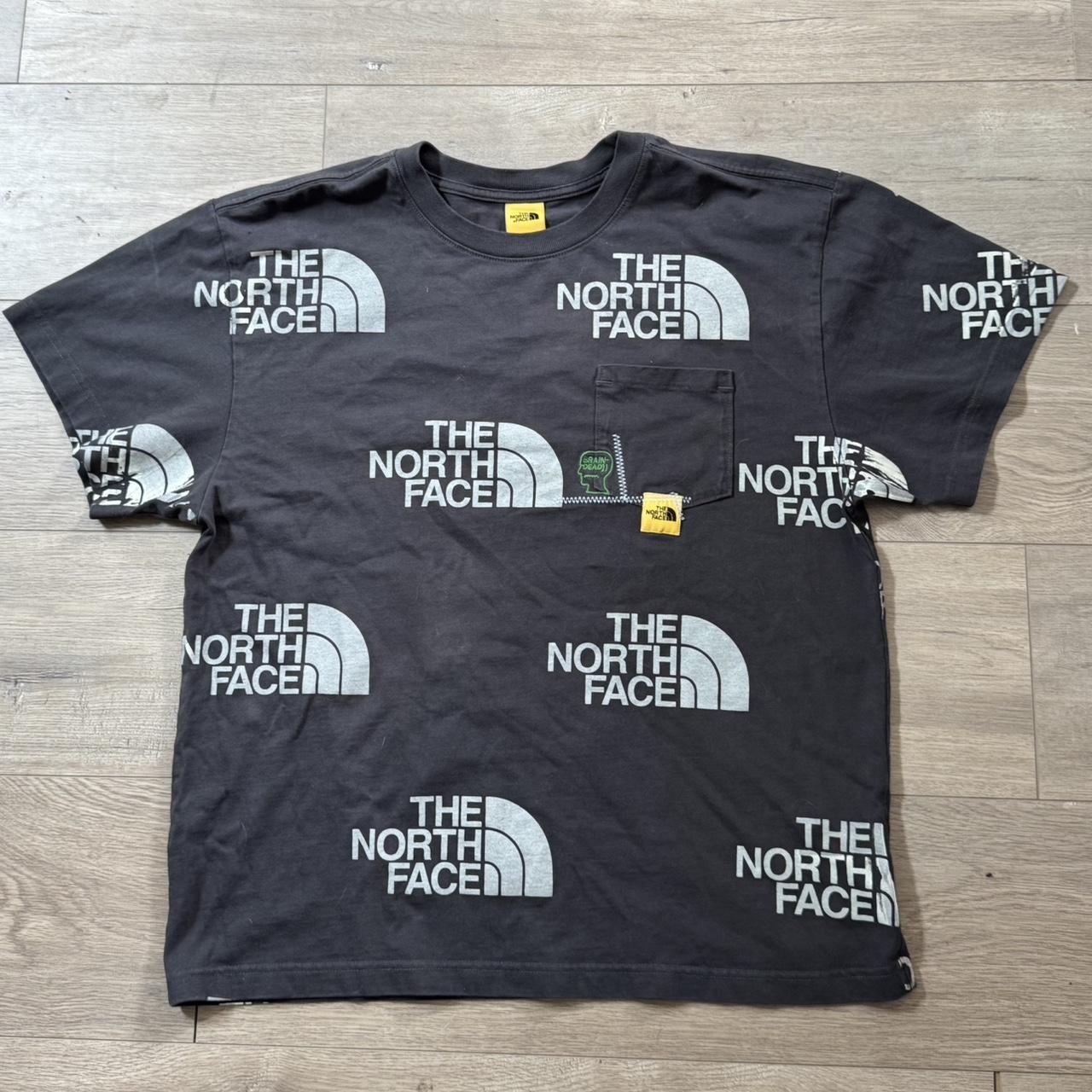 brain dead north face tee