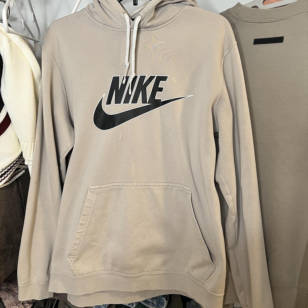 beige nike hoodie with black tick