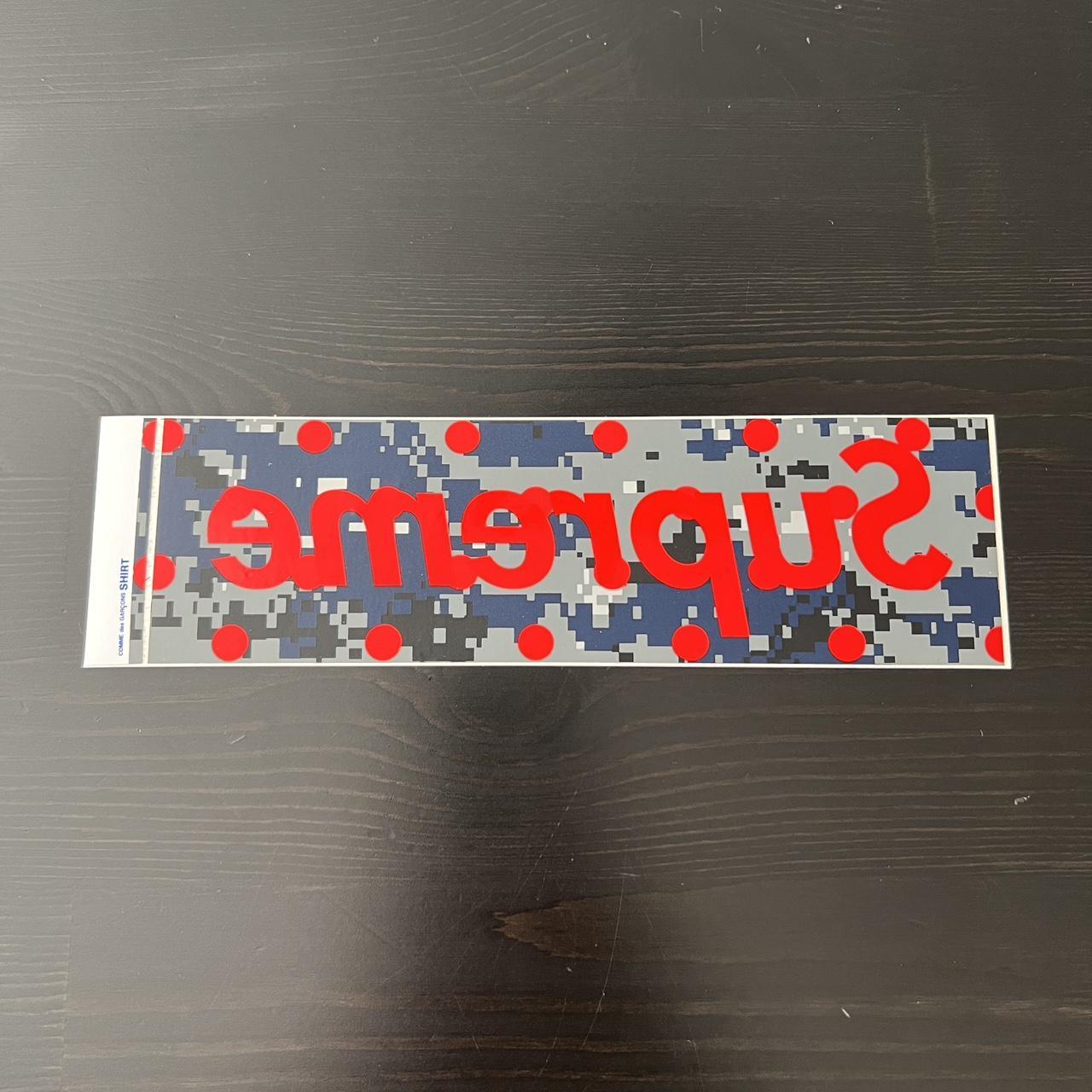 Comme des hotsell garcons supreme sticker