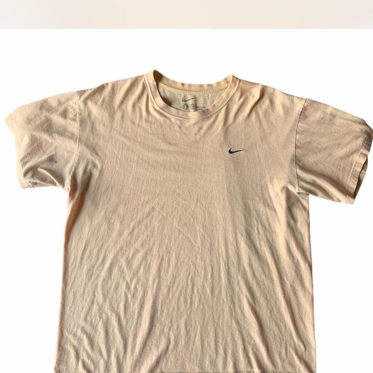 nude nike shirt