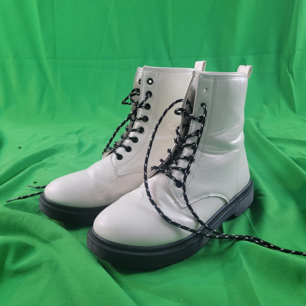 Black and white women's leather boot. Size 10.... Depop