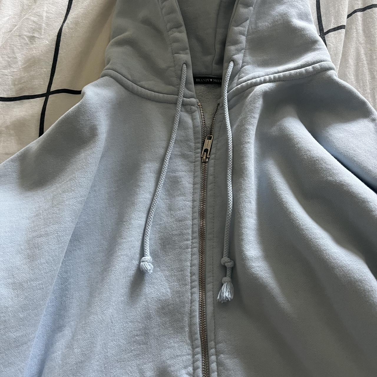 Brandy Melville Women's Blue And White Hoodie | Depop