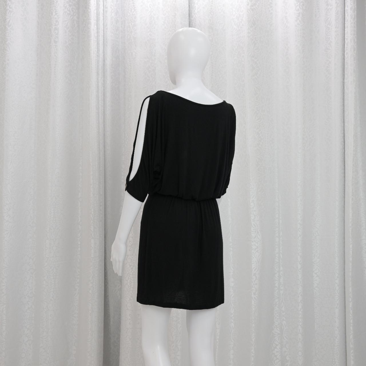 This is a Bella D black dress. It is cinched at the Depop