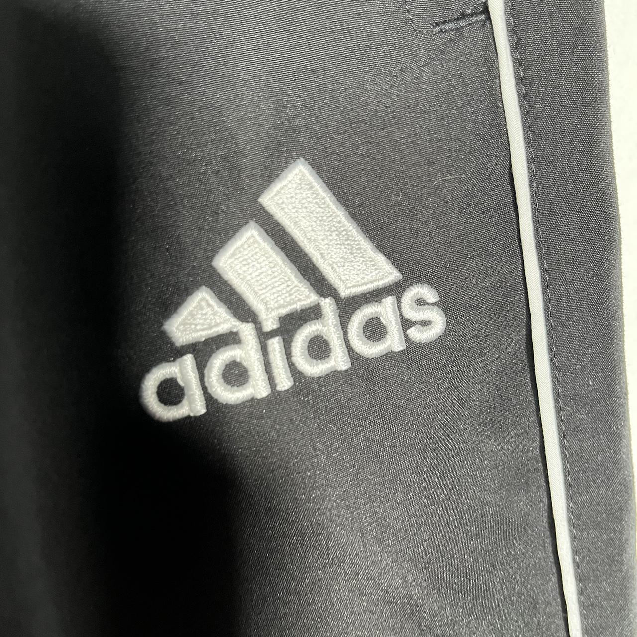 NP114 Adidas black striped track pants Size... Depop
