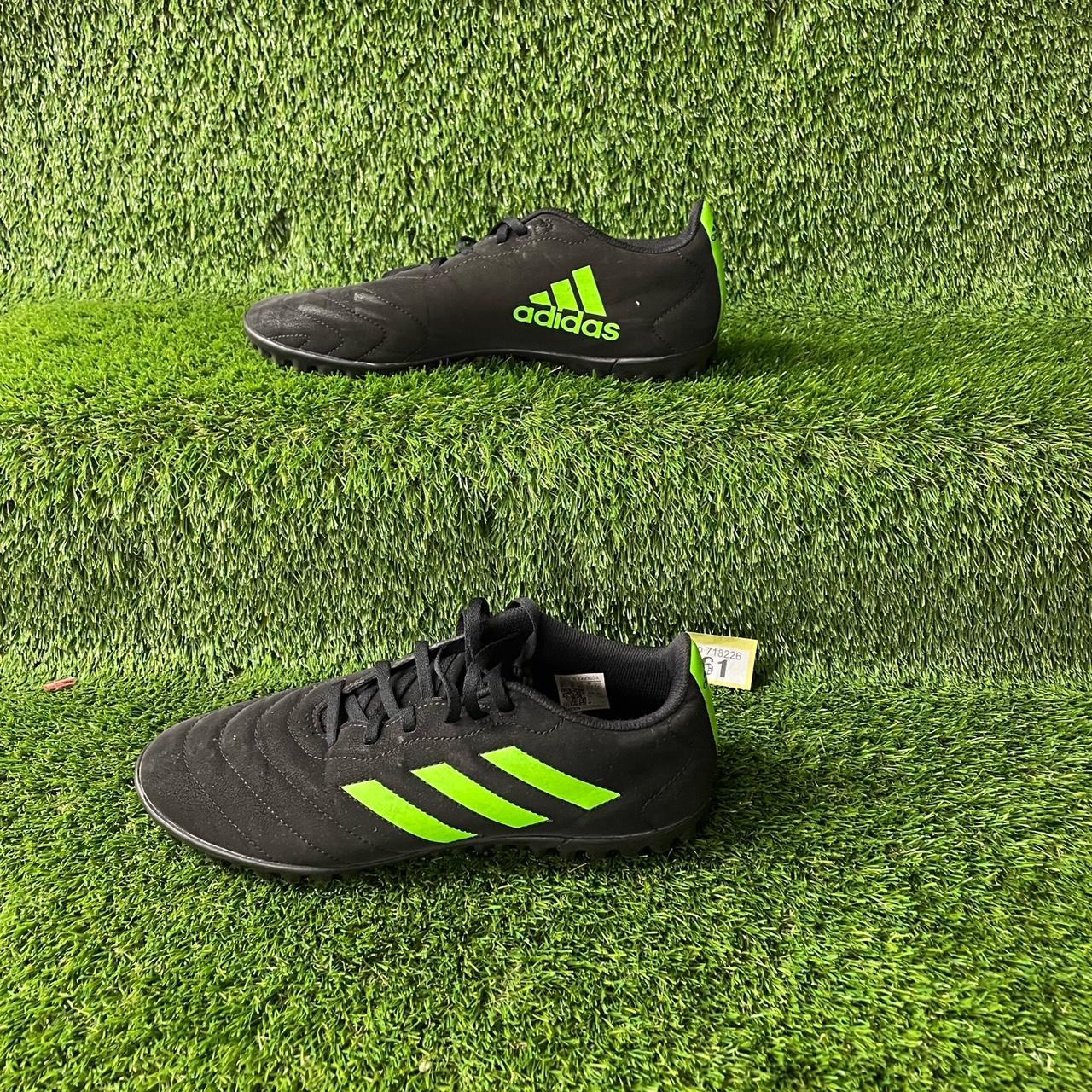 Y61 Adidas black and green football boots. Size 9.... Depop