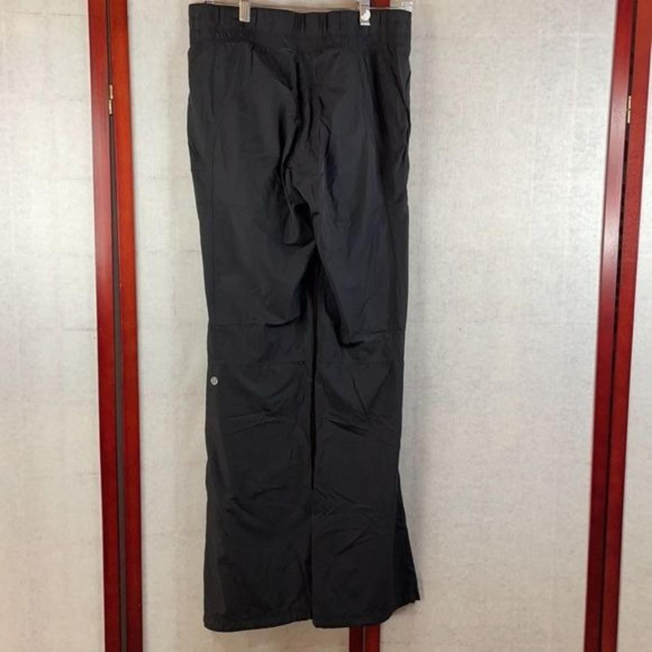 Black wide legged wind breaker pants with zipped... - Depop