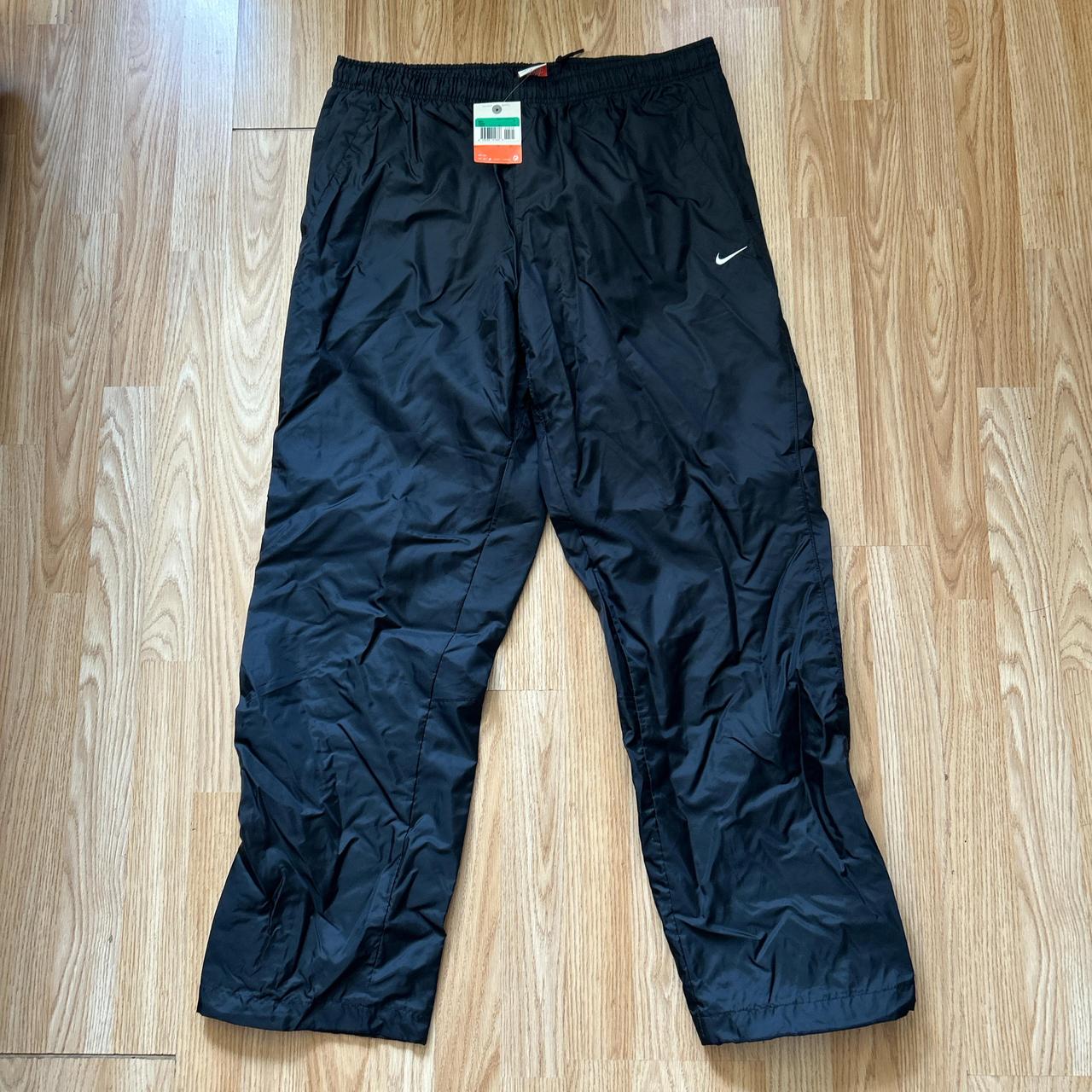 Nike waterproof tracksuit bottoms with drawstring. Depop