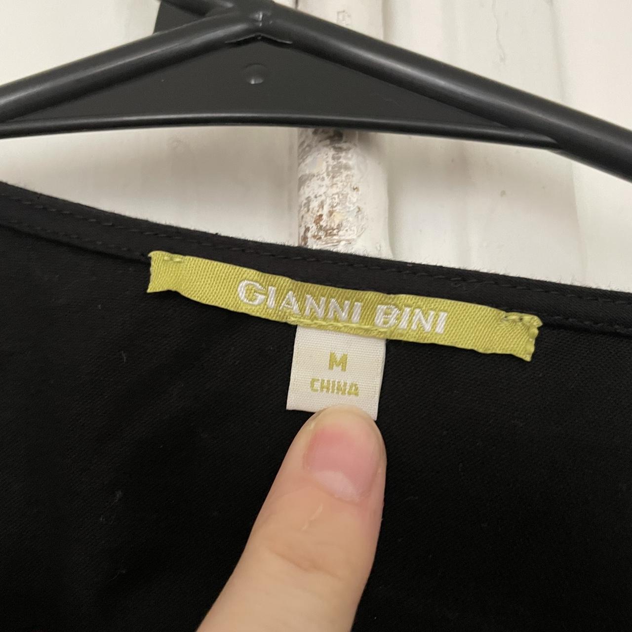 Gianni Bini black puff sleeve wrap top. In good... Depop