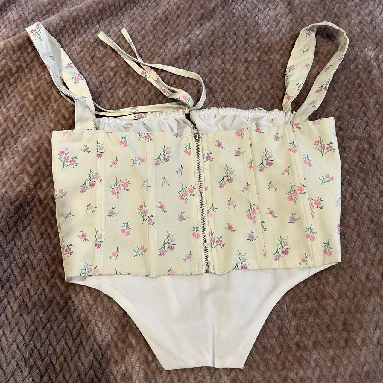 Yellow floral corset top size says medium fits more... Depop