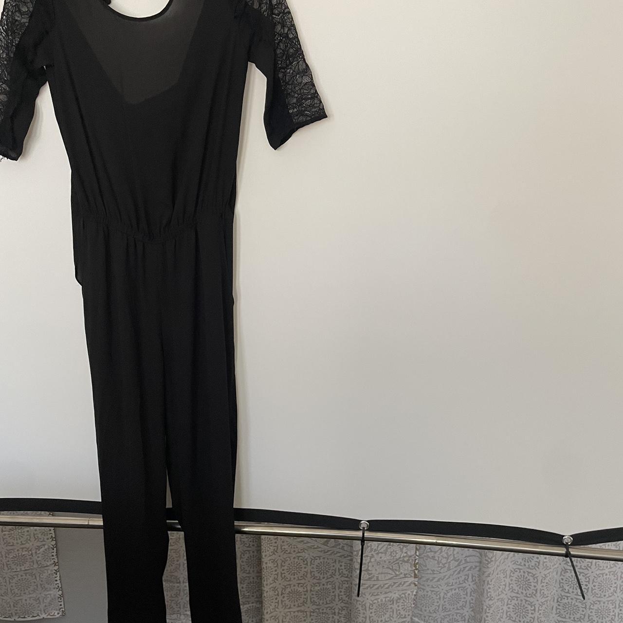 Black jumpsuit with lace detailing on the arms Depop