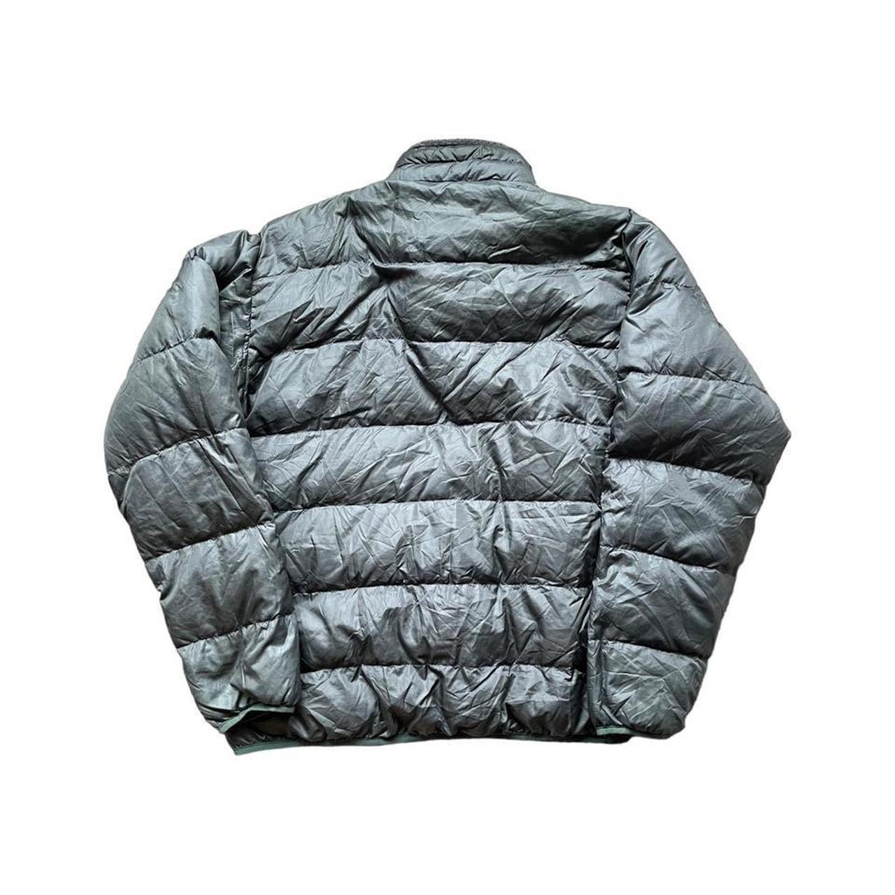 Montbell silver puffer coat with white spellout