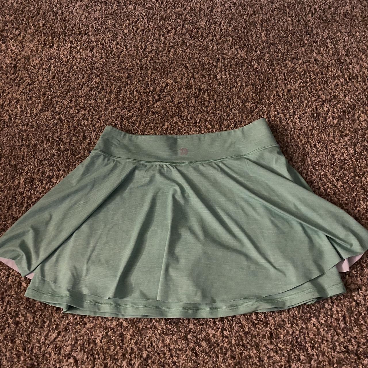 green athletic tennis skirt photos make it look more... - Depop