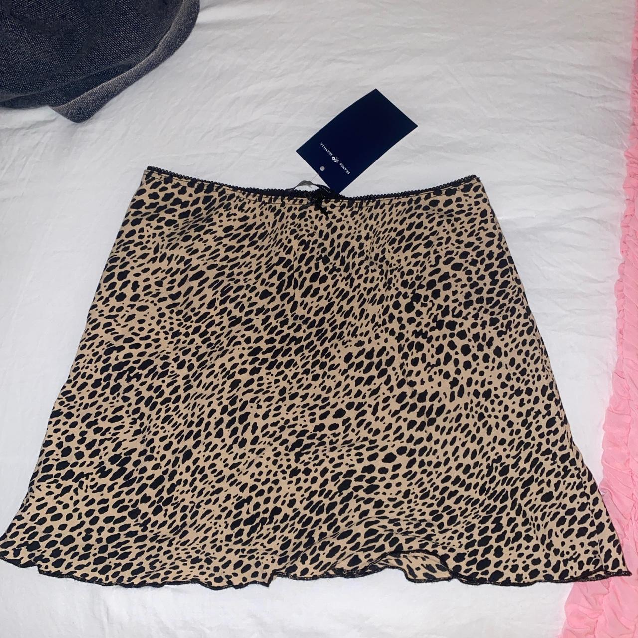 brandy melville printed skirt with black bow... - Depop