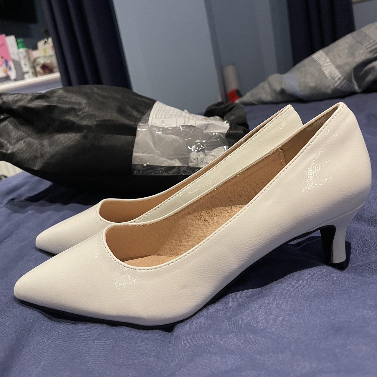 navy and white court shoes