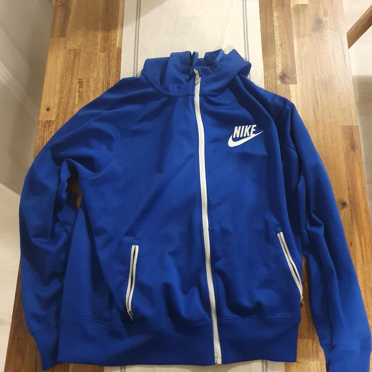 grey and blue nike tracksuit