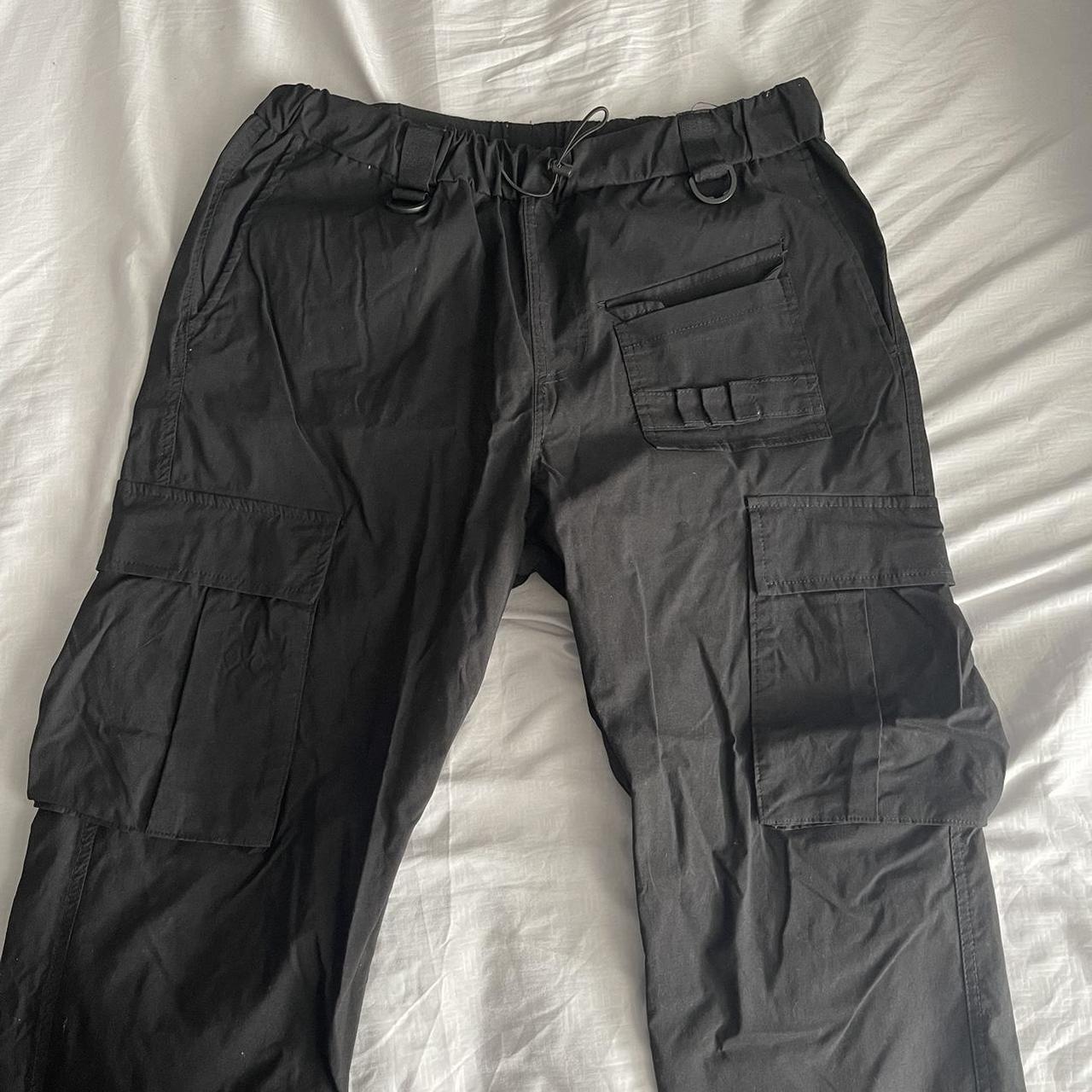 really cute black cargos. they do make like a swoosh... - Depop