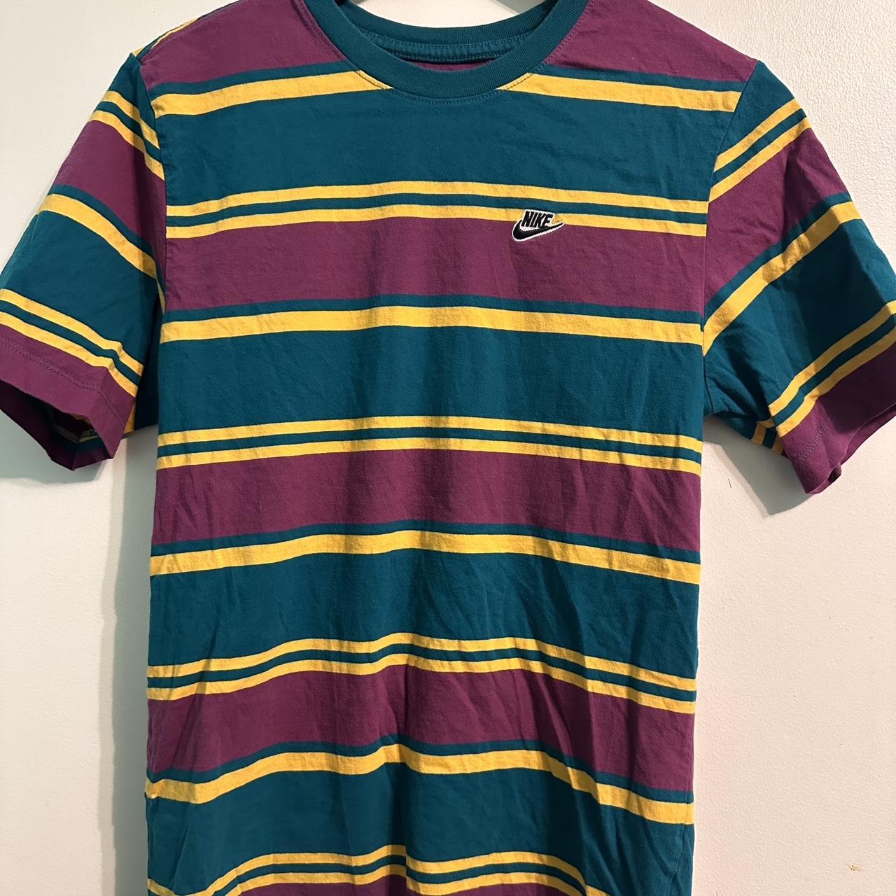 purple and green nike shirt