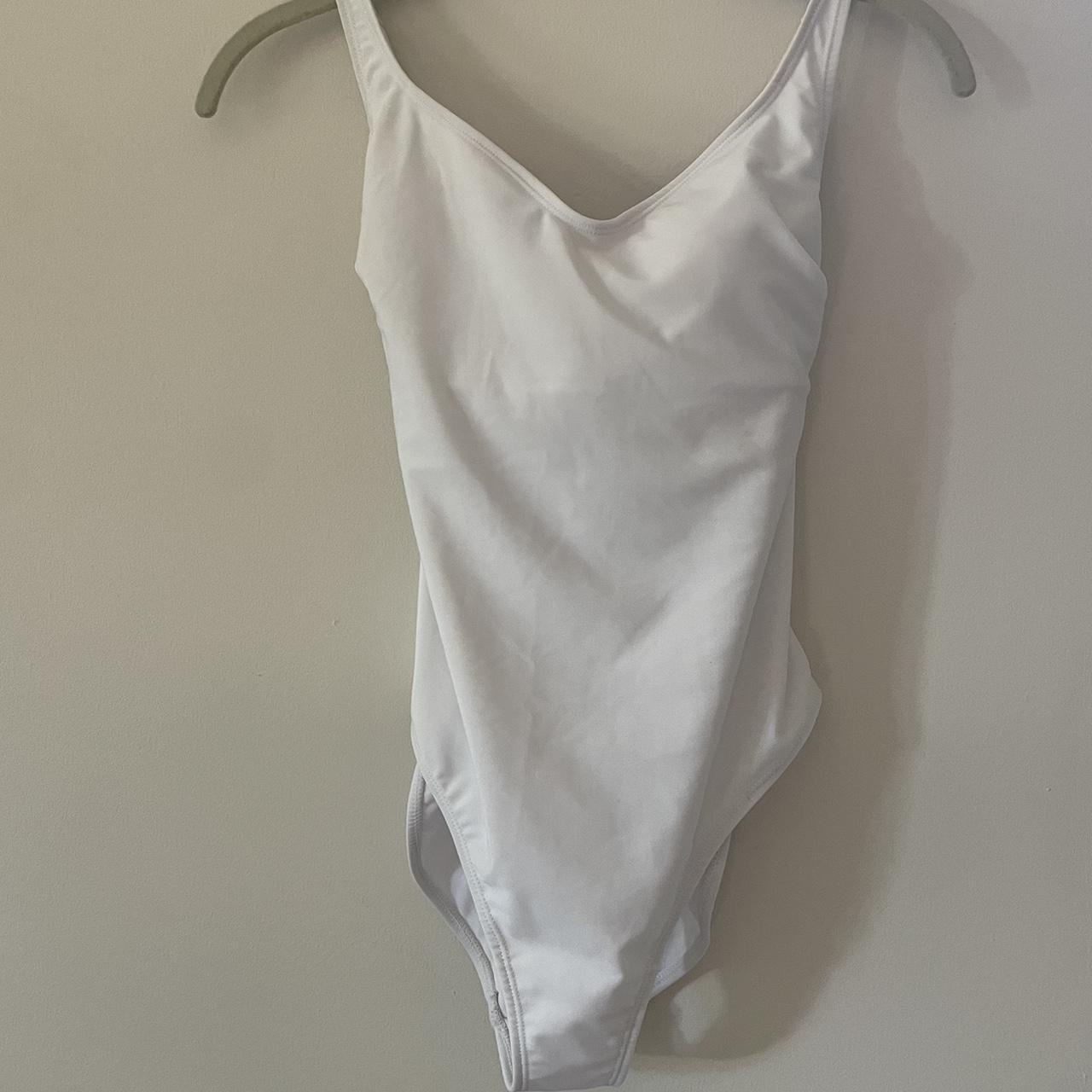 white one piece bathing suit with a cross-tied open... - Depop