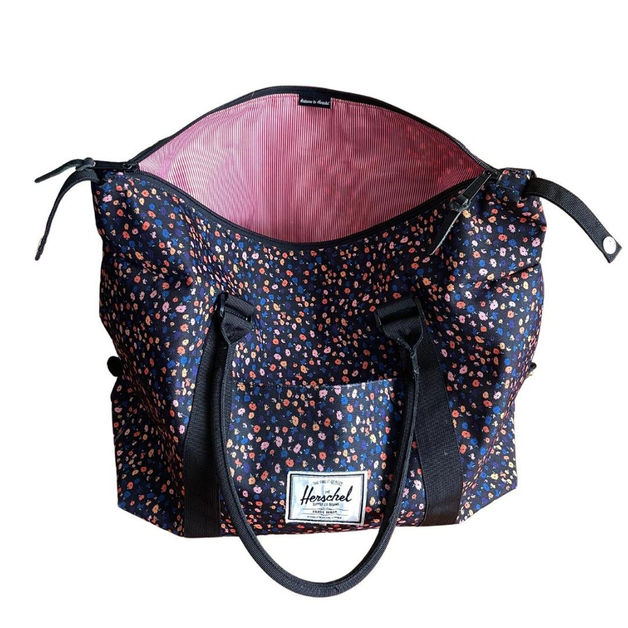 Herschel black duffle bag with colorful floral pattern. Depop