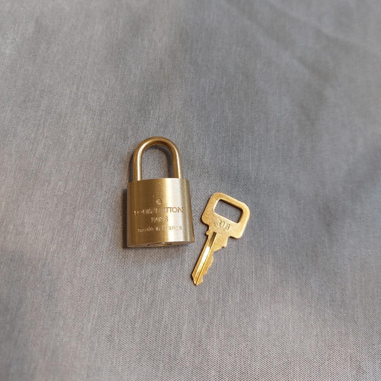 Authentic Louis Vuitton bag lock Gold / brass finish... Depop