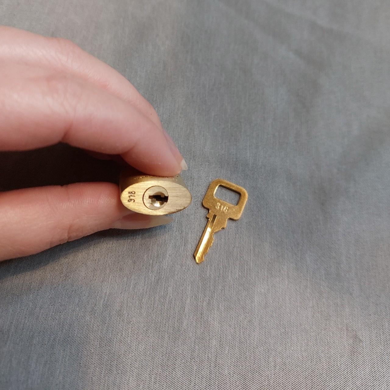 Authentic Louis Vuitton bag lock Gold / brass finish... Depop