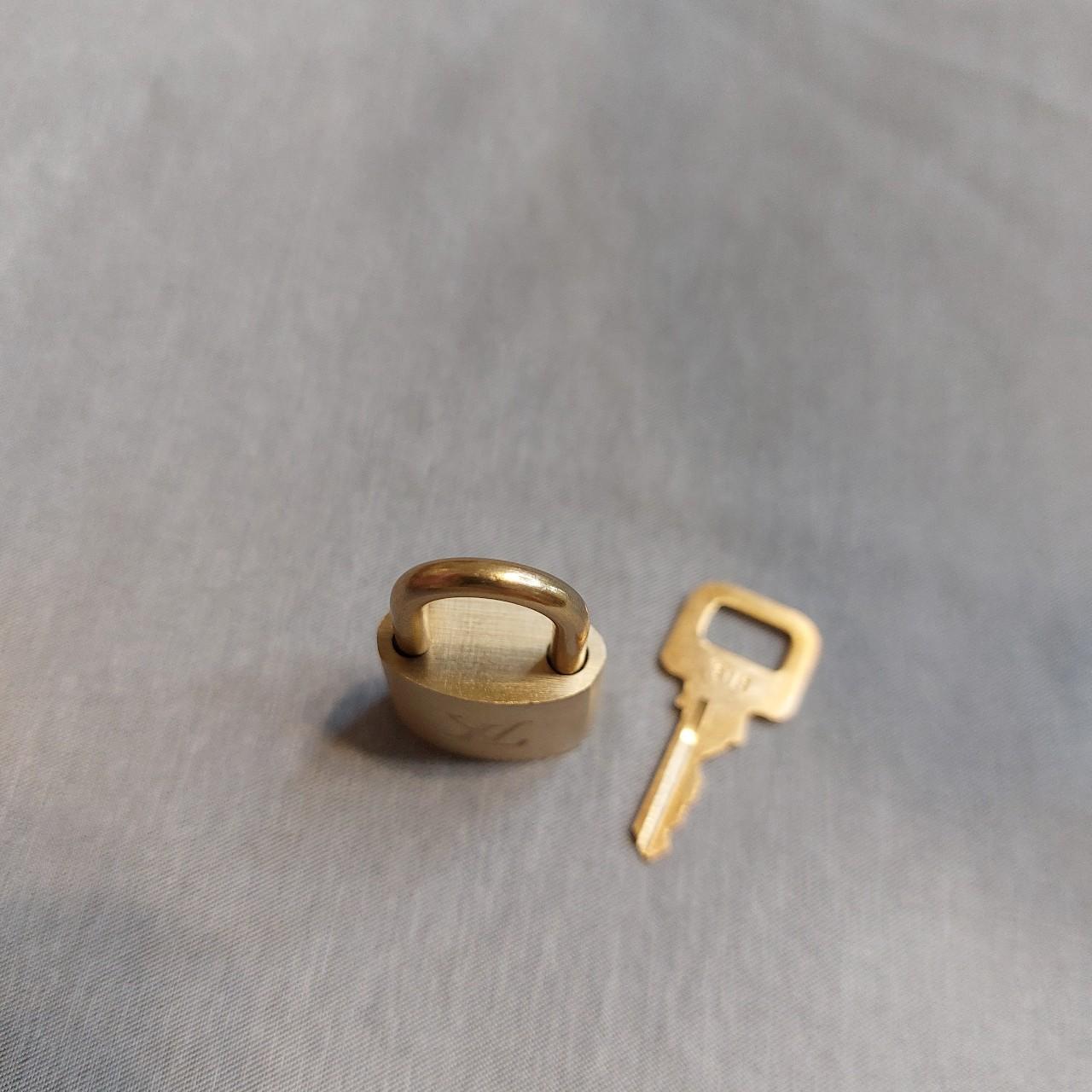Authentic Louis Vuitton bag lock Gold / brass finish... Depop