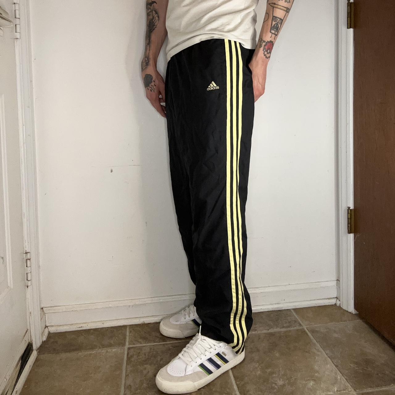 Black and hotsell yellow adidas pants