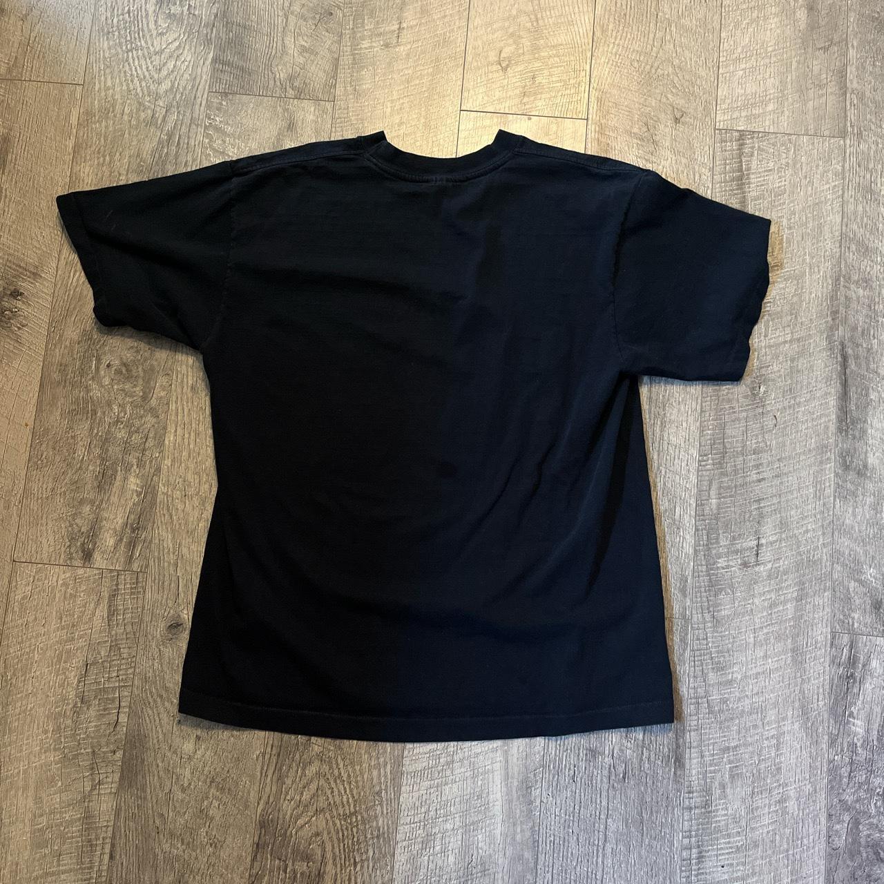 large black vintage tee:) Has one dark stain on the... - Depop