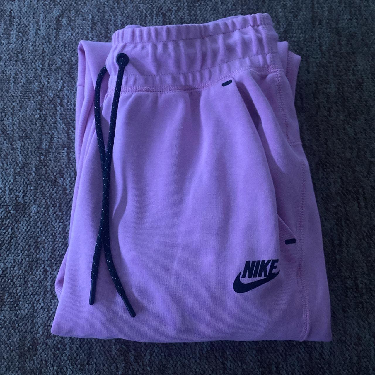 This is a pink nike tech tracksuit,which you can... - Depop