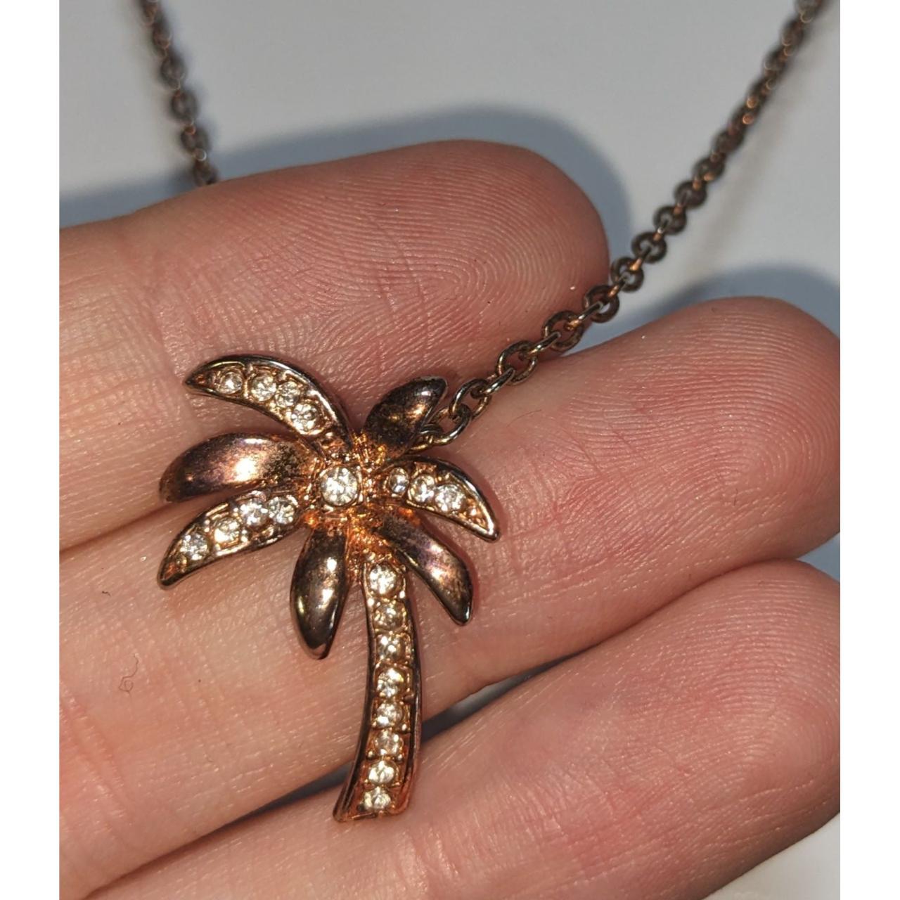 Copper rhinestone palm tree necklace., Roughly 16 in...