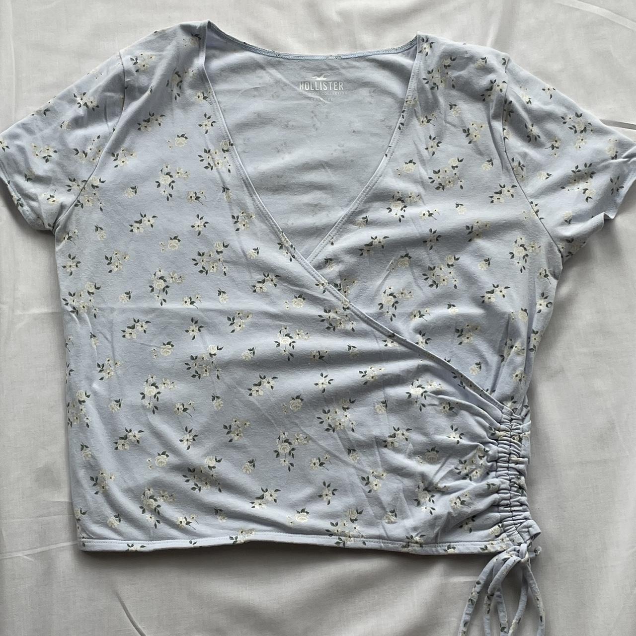 Hollister blue and white floral v-neck top with a