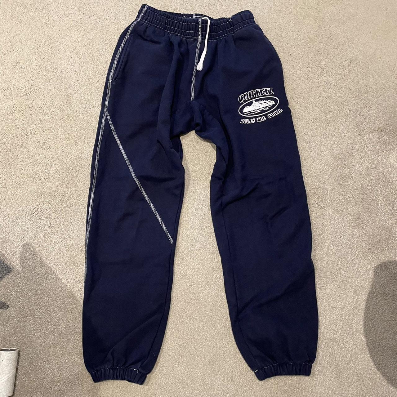 corteiz navy blue joggers. alcatraz logo on the leg.... - Depop