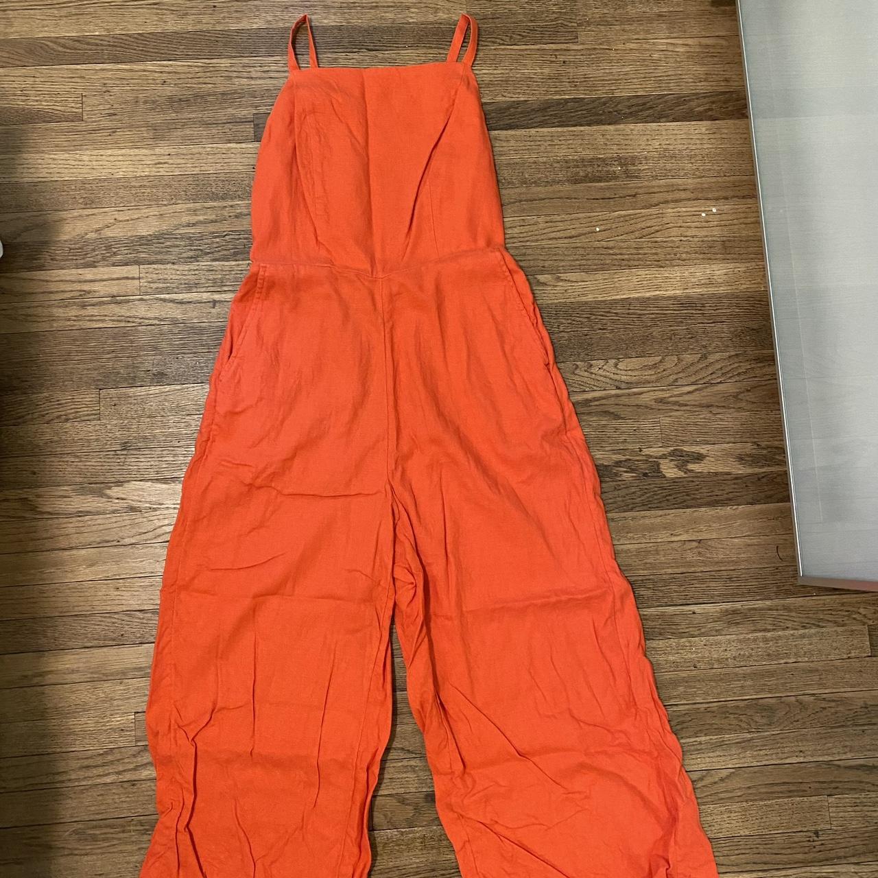 Red jumpsuit with pockets perfect for